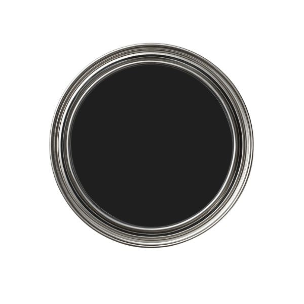 Black paint can lid on a white background